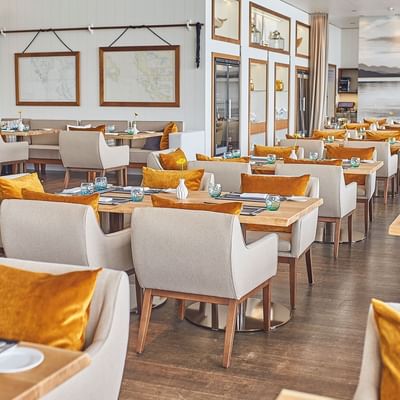 Dining area of Seespitz Restaurant & Living at Falkensteiner Schlosshotel Velden